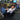 IFBB pro bodybuilder Jake Alvarez working out in style with Oxcloth's premium stretchable white shirt and navy blue chinos